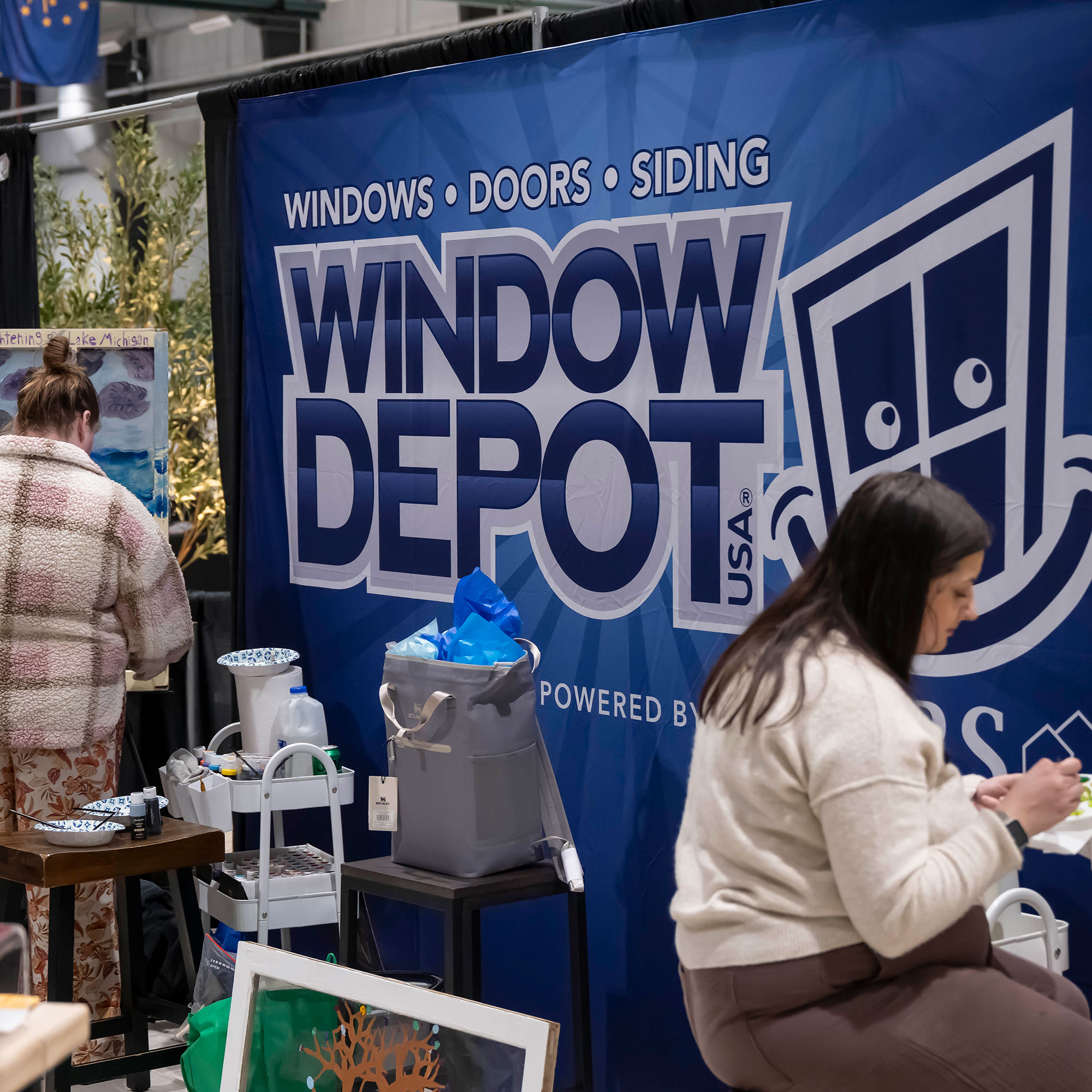 People attending a Window Depot USA of Lafayette and Big Brothers and Big Sisters Event.